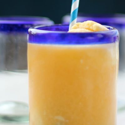 Ginger Peach Float in a blue rimmed glass with a straw.
