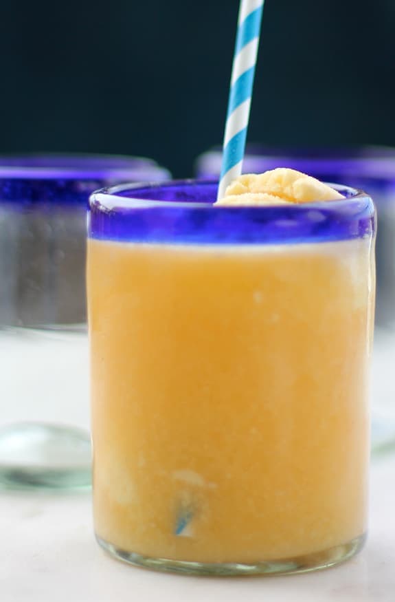 Ginger Peach Float in a blue rimmed glass with a straw.