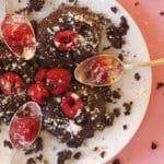 Overhead photo of gluten-free chocolate lava cake topped with raspberries.