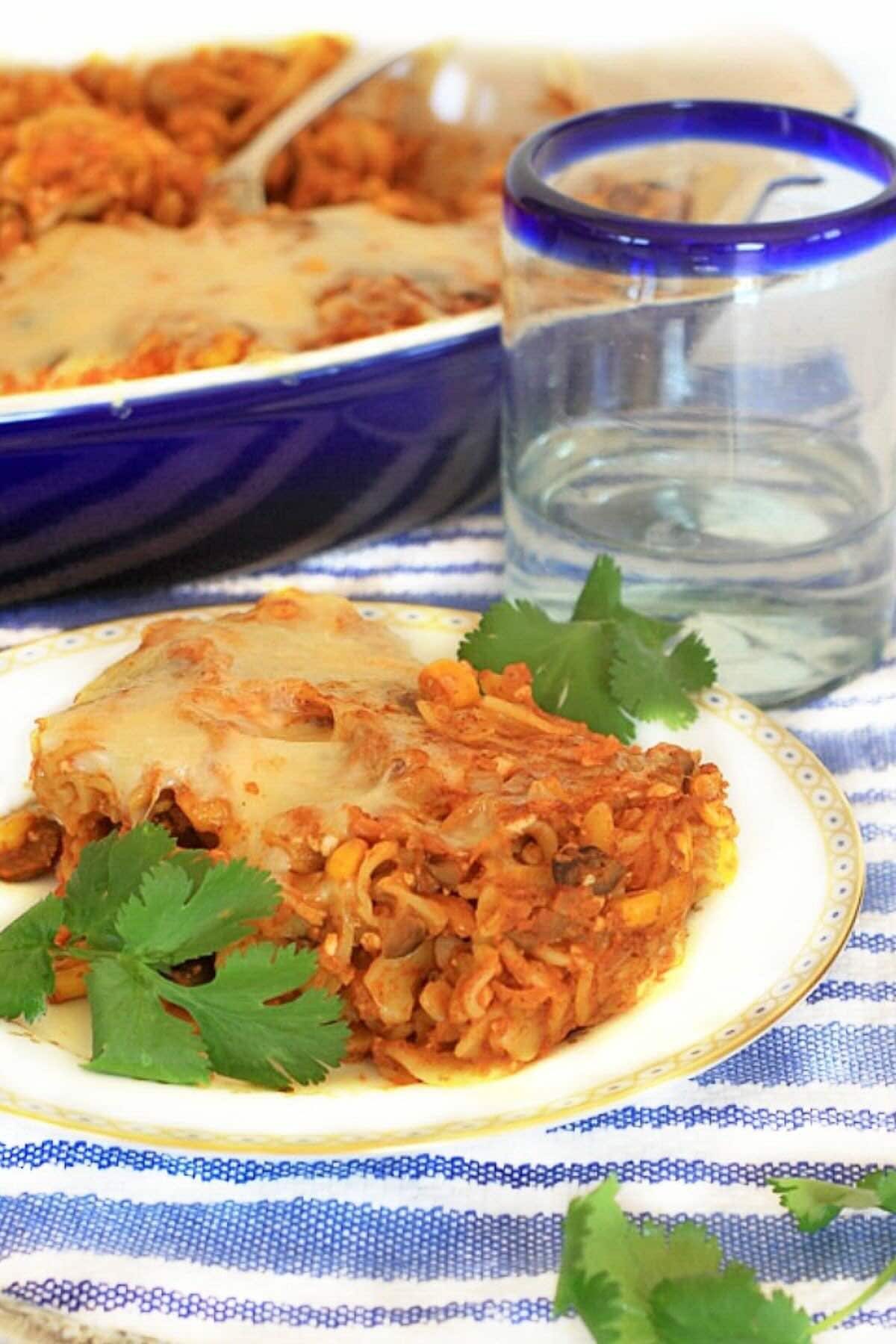 Vertical photo of baked enchilada pasta.
