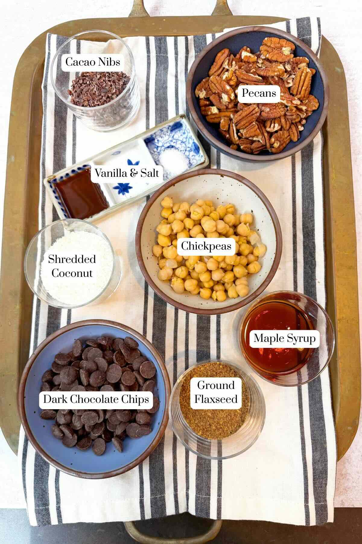 Ingredients on a tray to make chocolate energy balls.