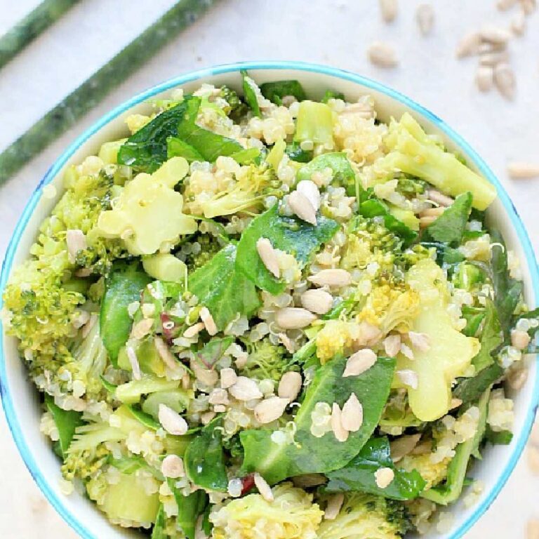 Bowl of miso broccoli quinoa salad with greens.
