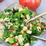 Square glass bowl with fall chopped apple salad.