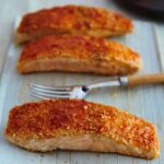 Close up photo of 3 sesame sticky salmon fillets.