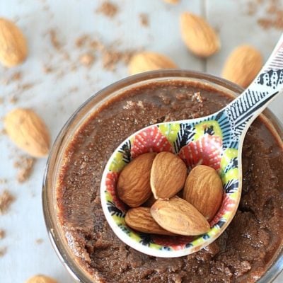 Low in sugar, and rich in nutrition and flavor, this 5 ingredient Mexican Chocolate Almond Butter is super easy to make & much more economical than store bought nut butters.