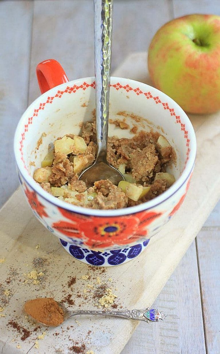 This healthy mug cake with apples and chai spices, is a delicious treat for breakfast or dessert! It's gluten free, dairy free, grain free, and paleo. Oh, and it's super quick and easy to make! Serve it with Greek yogurt for a delicious protein packed breakfast. #mugcake #fallrecipes #healthybreakfast
