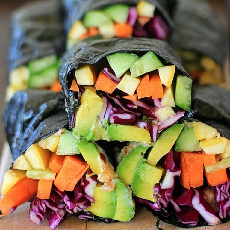 vegetable nori wraps on a wooden cutting board