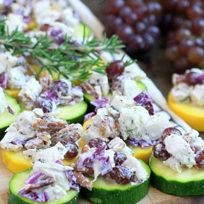 Easy Low Carb Rosemary Pecan Chicken Salad on Zucchini Chips. Slightly addictive, but oh so healthy and delicious!