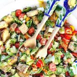 This Easy Greek Panzanella Salad is a delicious way to clean out the fridge & eat more veggies! Get the recipe at EA Stewart, The Spicy RD @thespicyrd | Gluten Free, Vegetarian, & Low FODMAP