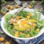 This Sunshine Savory Oatmeal w/ Egg, Arugula, Tomatoes, and Avocado, is the ultimate healthy comfort food for breakfast, or any meal of the day! Get the gluten free and vegetarian recipe at EA Stewart, The Spicy RD @thespicyrd