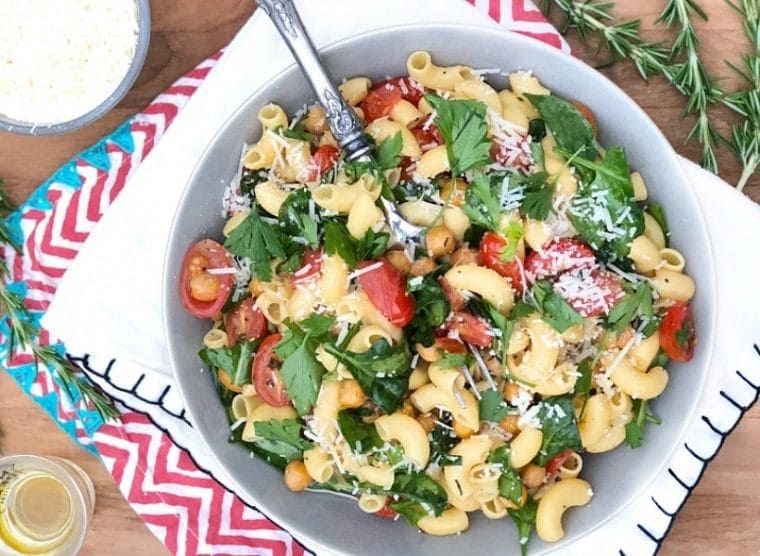 healthy gluten free recipes - pasta salad with tomatoes, chickpeas, and spinach in a bowl