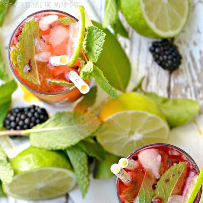 mocktail recipes - 2 glasses with berry sparkler, mint, and straws