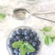 Coconut Chia Pudding on a white marble tray with 2 spoons.
