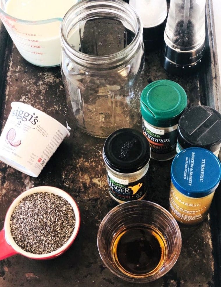 Metal tray with ingredients to make coconut chia pudding.