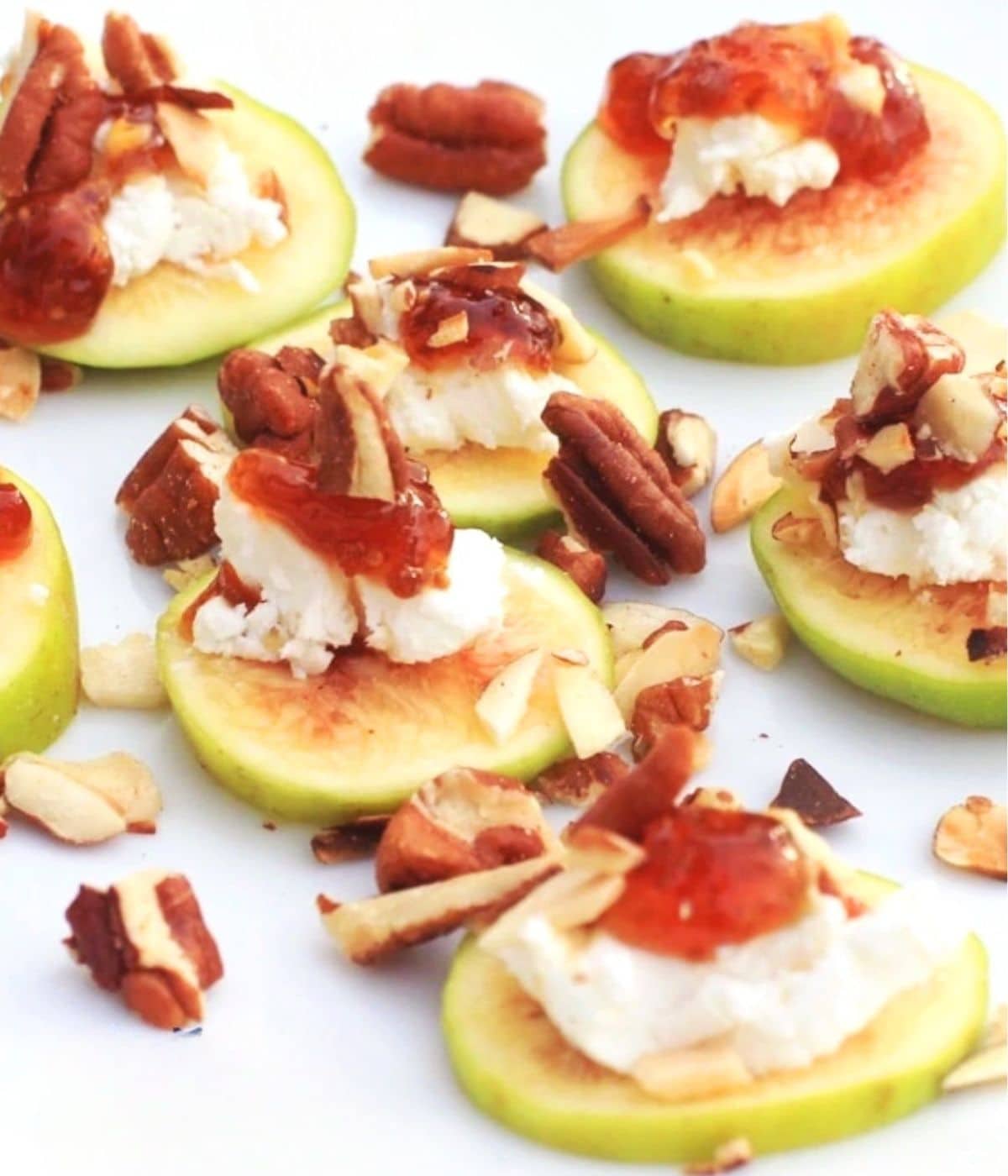Goat cheese and fig appetizer, topped with nuts and fig preserves.