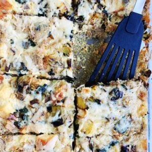 Close up shot of a gluten-free breakfast casserole with a serving spatula.