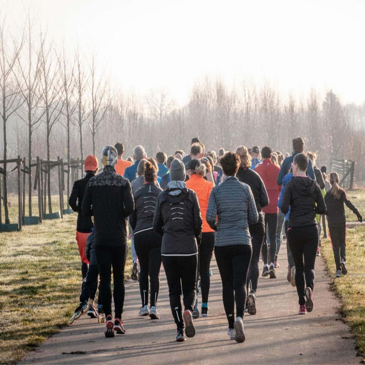 group of women running in cold weather.