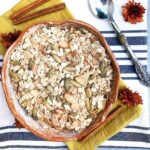 Ceramic bowl filled with gluten free muesli with pumpkin seeds and almonds.