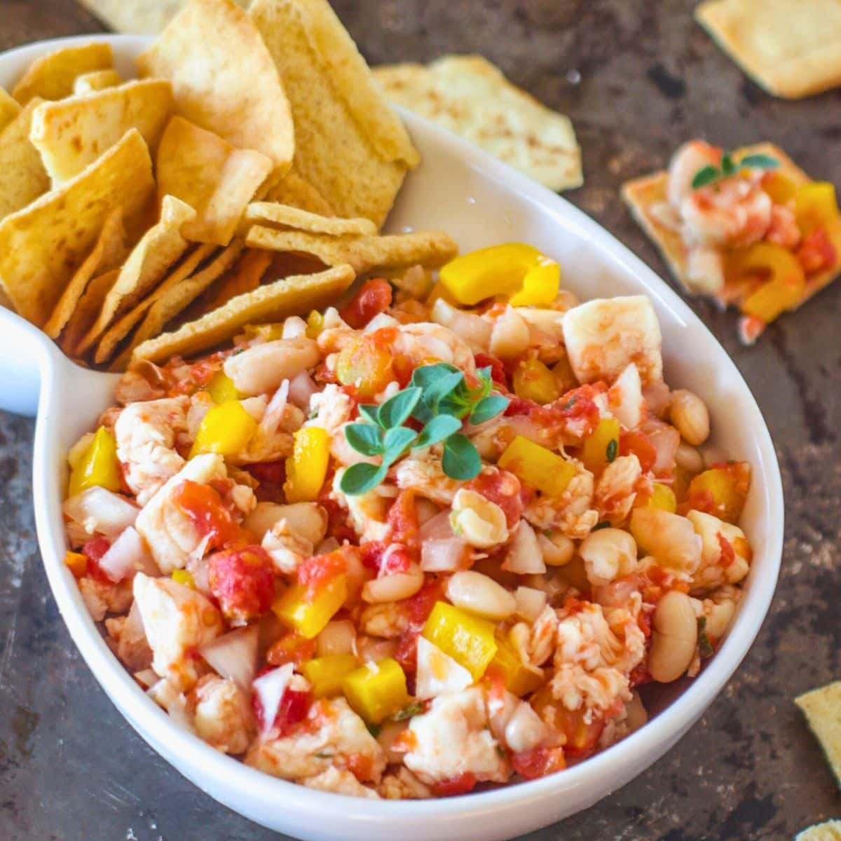 White bowl with halibut ceviche and tortilla chips.