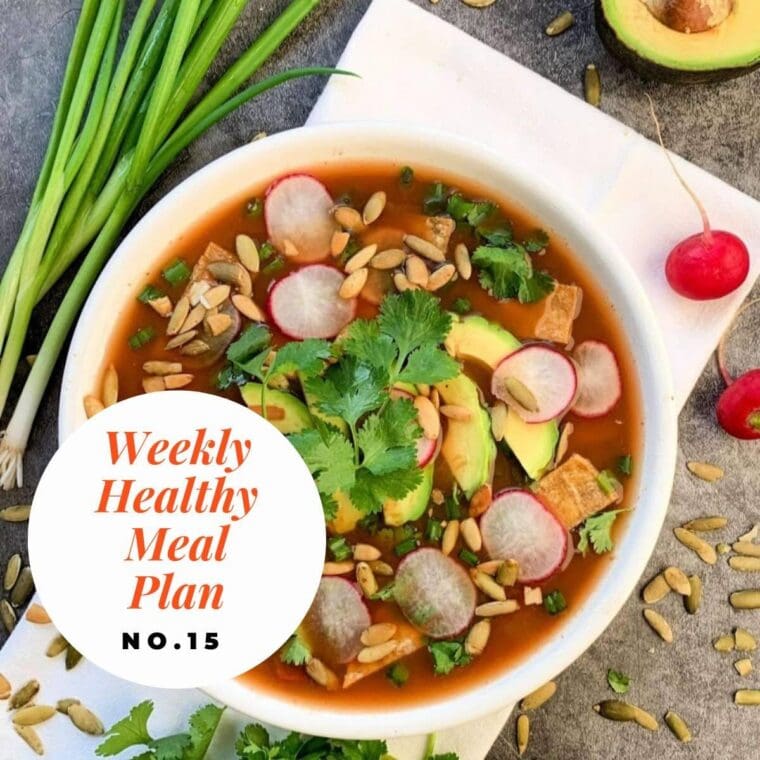 Bowl of tortilla soup with toppings.